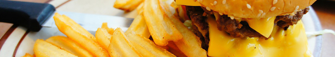 Eating Burger at Big Picture Burgers restaurant in Kathleen, GA.